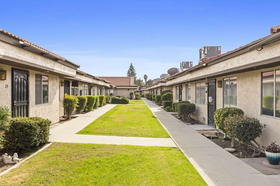 Manor II courtyard with covered patio and lawn